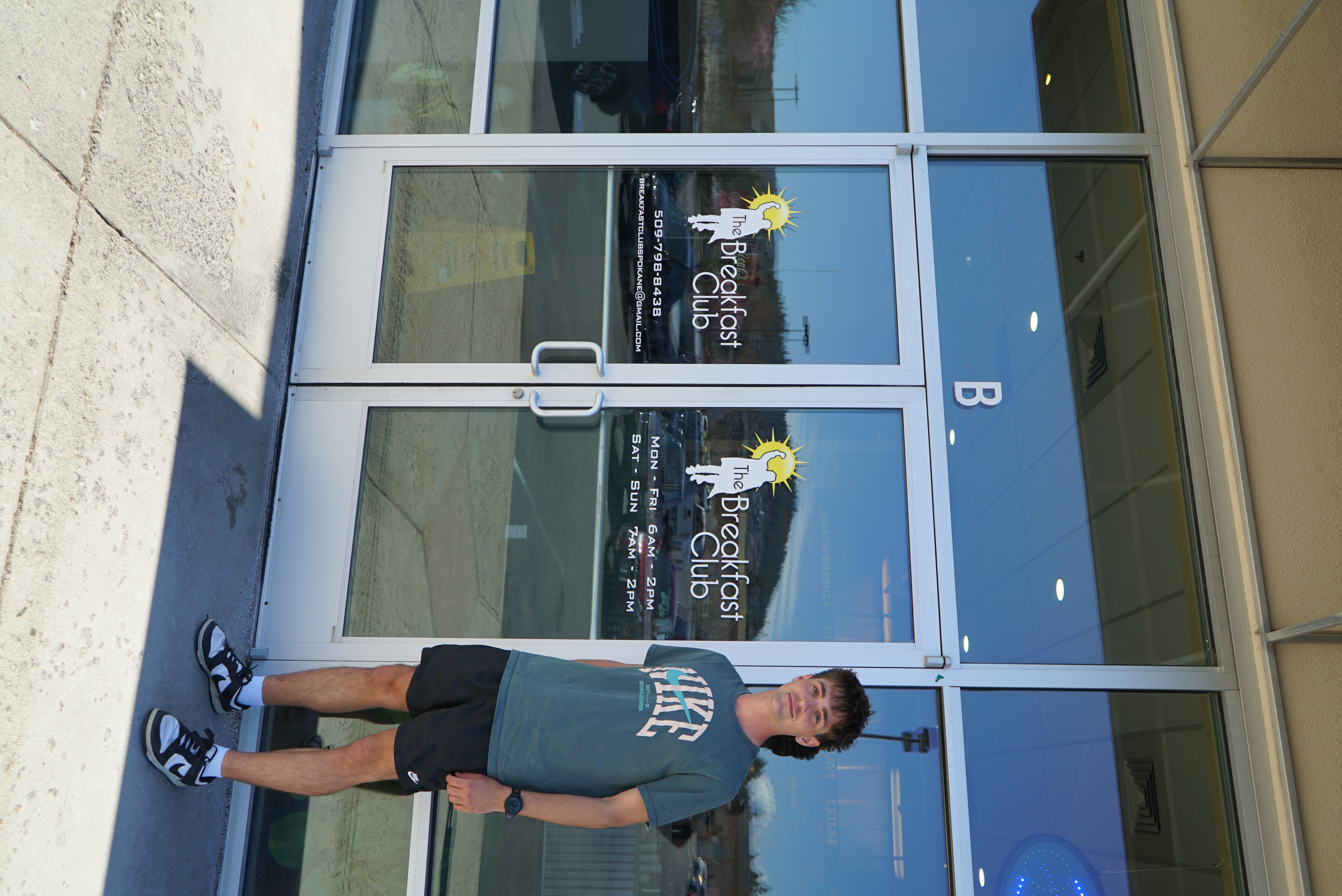 Student-athlete outside a local partner business
